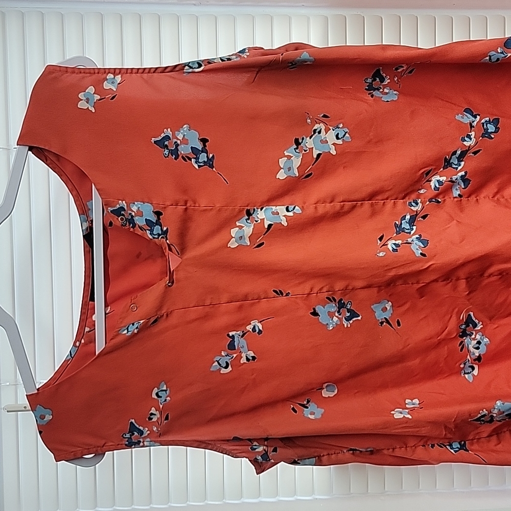 Orange Attention xl blouse with floral pattern.